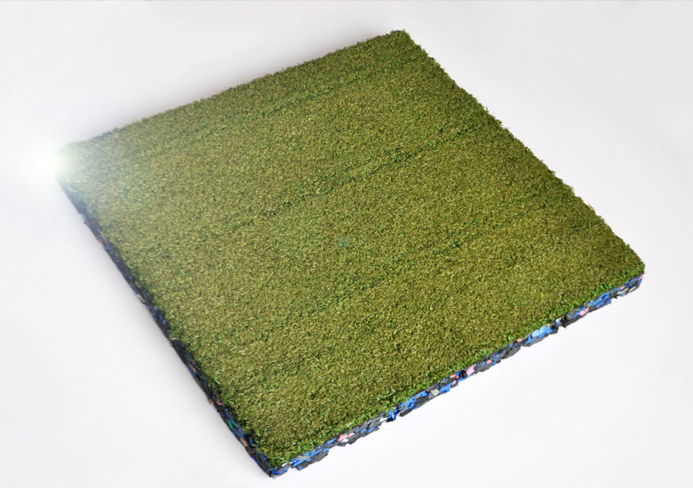 Green astroturf square tile on white background