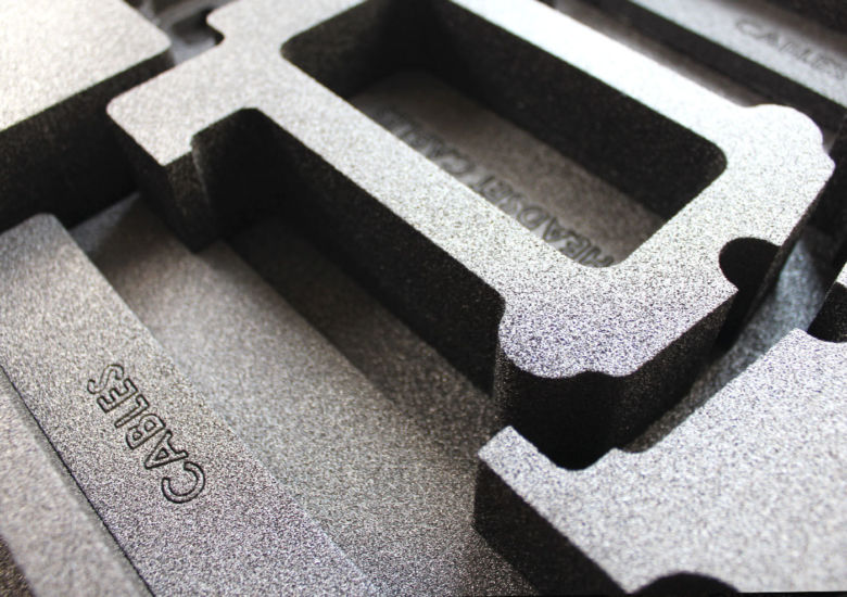 Grey foam insert with bespoke cut out sections for tools