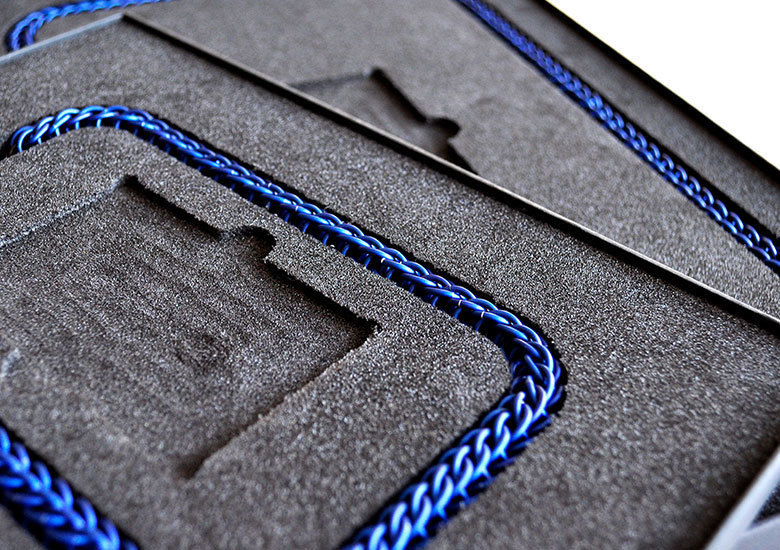 A foam insert containing a blue metal chain